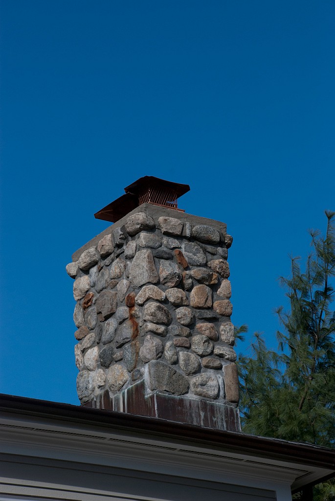 DSC_8278.jpg - Two caps go on the other chimney, with flues for both wood fires and the gas furnace.