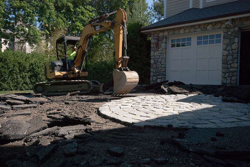DSC_1769.jpg - Dorian Delgado. the owner of Apex Paving, did much of the demolition work himself.