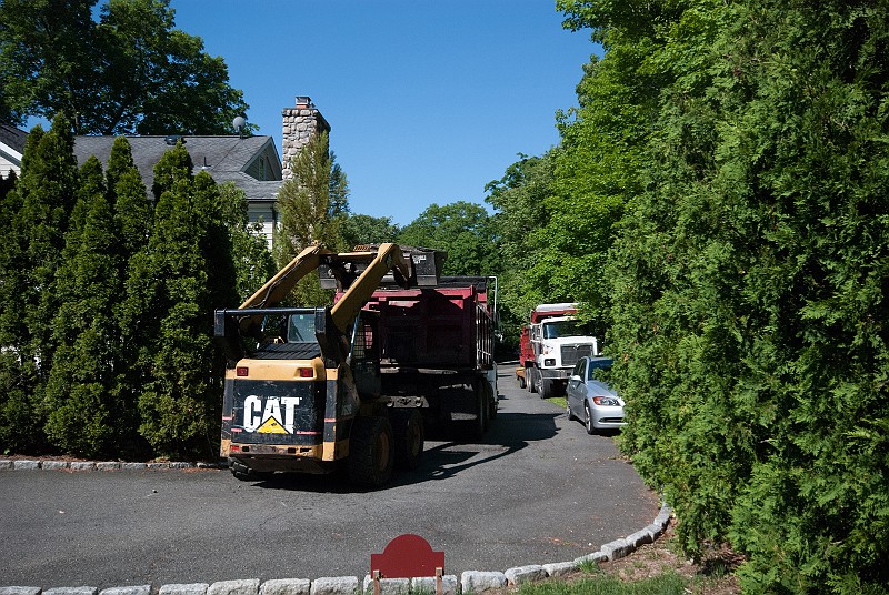 DSC_1777.jpg - The loose asphalt gets loaded on the dump truck and carted away.