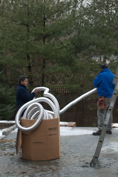 DSC_9058.jpg - The insert installers wrestle with the flex ducts.