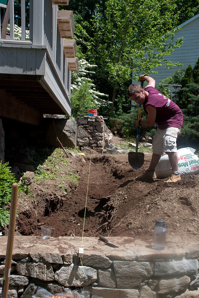 DSC_8542.jpg - Austin is digging for a new bed where a set of boxwoods will be planted.