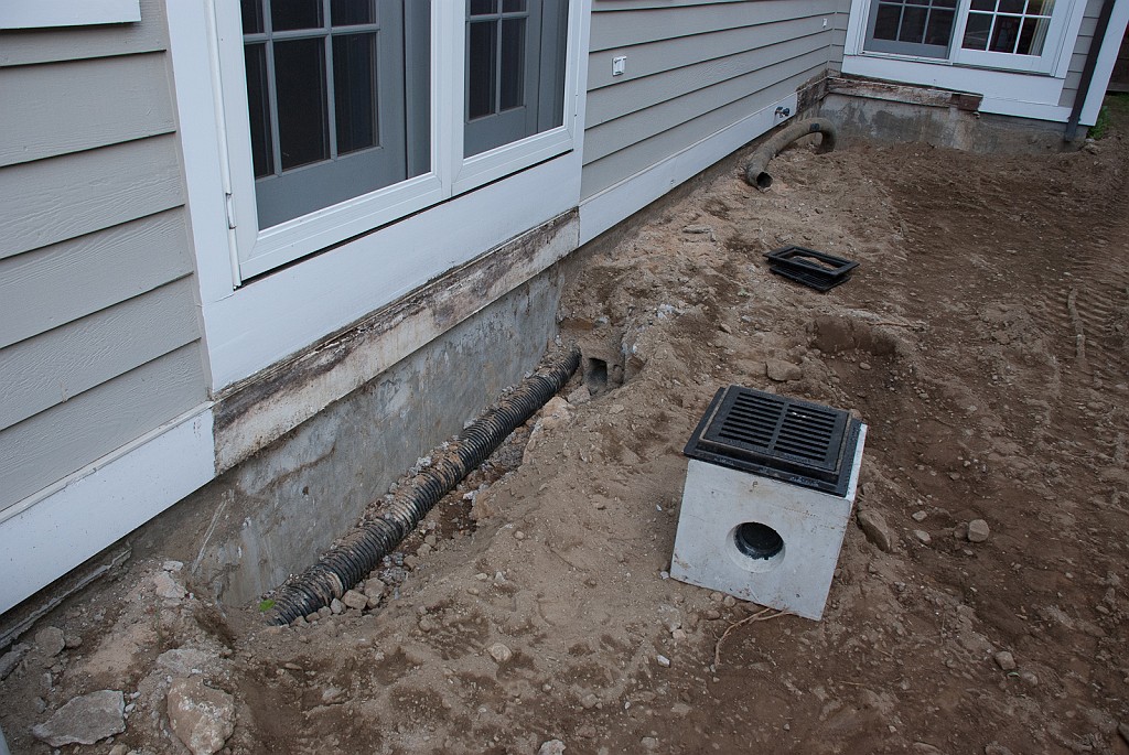 DSC_8575.jpg - The old flexible drainage pipes to be removed and one of the concrete drain boxes that will be part of the new system.