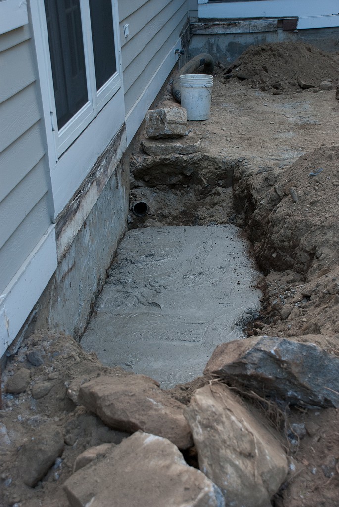 DSC_8586.jpg - Harold mixed and poured the concrete for the footing for one set of new steps.