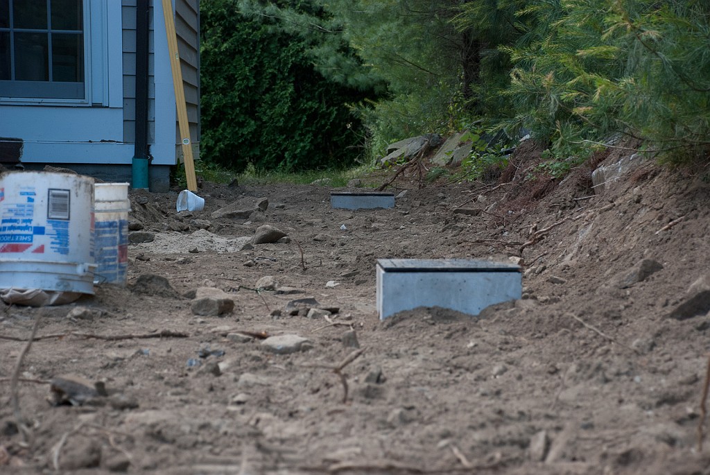 DSC_8588.jpg - Now the drain boxes are in place and leveled.  The new ridgid connecting drain pipes are installed and buried.