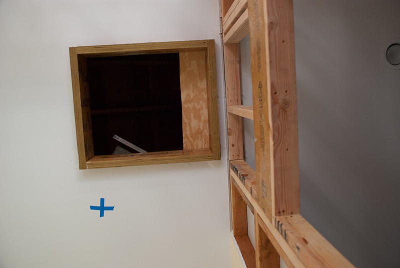 DSC_9557.jpg - Looking overhead, the hatch for the attic is framed in with LVL stock.  The "+" marks the location for one of the new Cree LED lights.