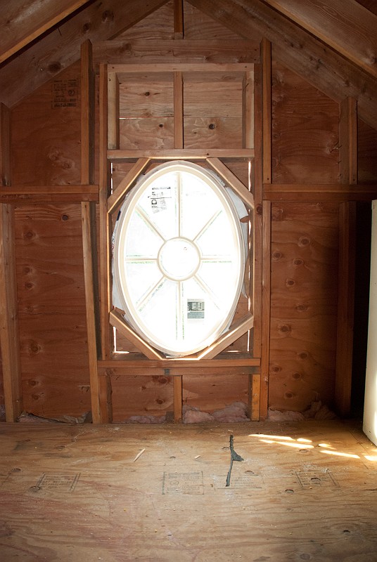 DSC_9563.jpg - The oval window is framed in, but at the bottom, rather than the middle, of the old double hung window.