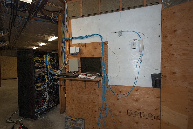 DSC_2667.jpg - The "systems" aspect of the Greenwich II house are dauntingly complicated.  Let's start with someting simple:  Here, I am rebuilding the Cat5 telephonic/ethernet cabling, starting with just two phones.