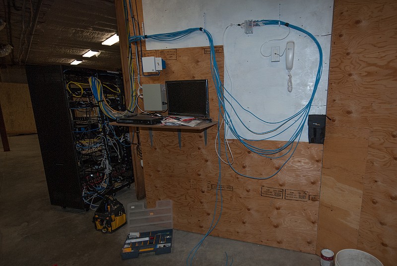 DSC_2692.jpg - I've now added most of the traceable Cat5 phone cabling to my connecting block.  There are still many "mystery cables."  Things will get neater as I go on.